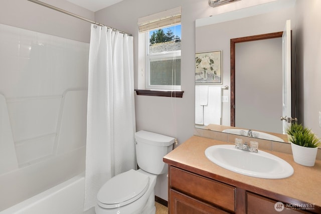 bathroom with vanity, shower / bath combination with curtain, and toilet