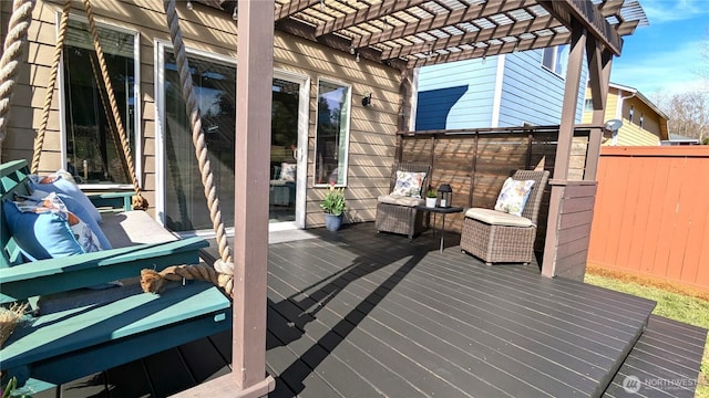 wooden terrace featuring fence and a pergola