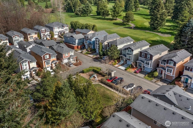 birds eye view of property with a residential view