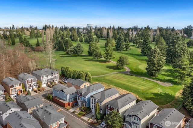 birds eye view of property with a residential view and view of golf course