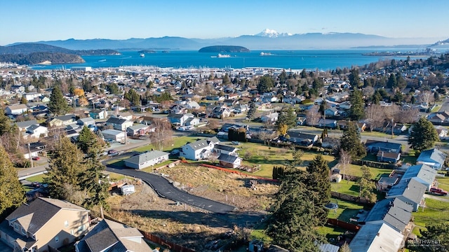 aerial view with a residential view and a water and mountain view