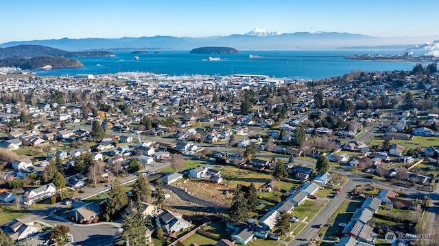 bird's eye view featuring a water and mountain view