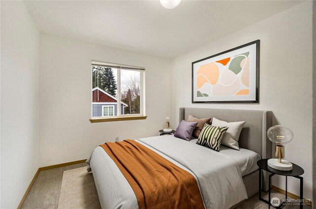 carpeted bedroom featuring baseboards