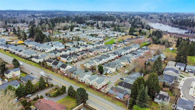 bird's eye view featuring a residential view and a water view