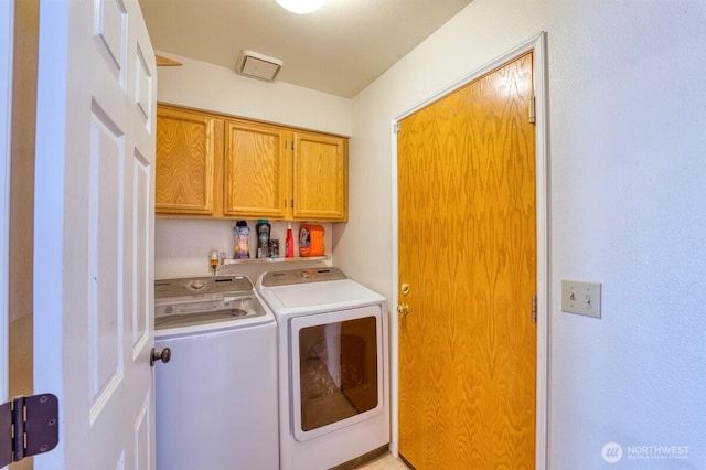 laundry area with cabinet space and washing machine and dryer