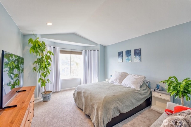 bedroom featuring lofted ceiling and carpet floors