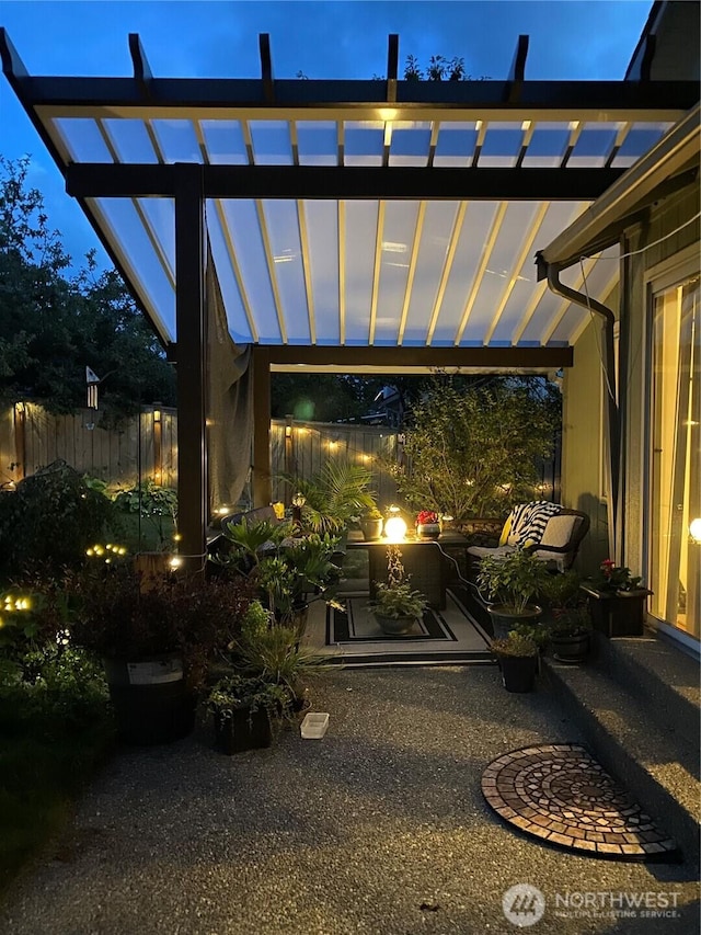 view of patio featuring fence and a pergola