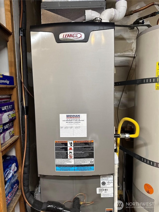28016 234th Ave SE, Maple Valley, WA 98038 - utility room featuring strapped water heater and heating unit
