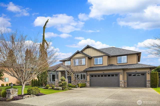 view of front of house with a shingled roof, concrete driveway, a garage, stone siding, and board and batten siding