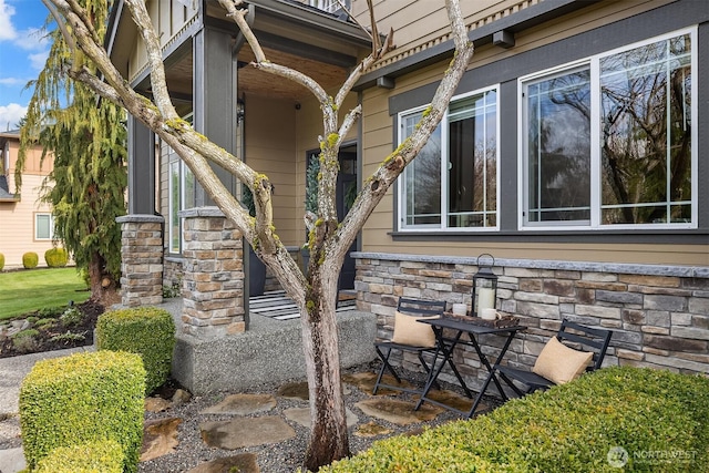 exterior space featuring stone siding