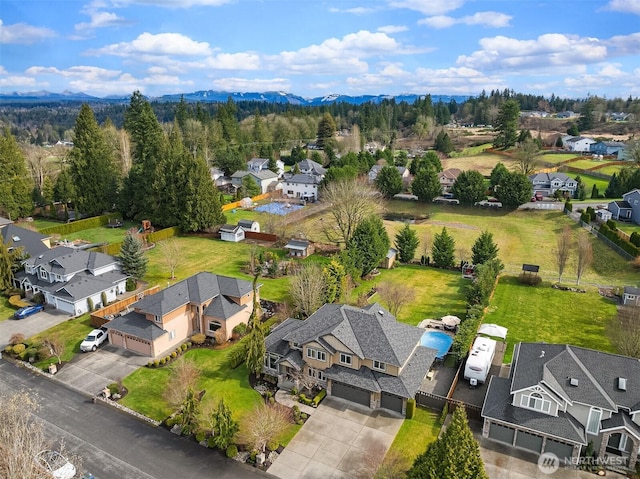 aerial view featuring a mountain view and a residential view