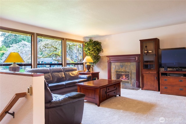 living area with a fireplace and light colored carpet