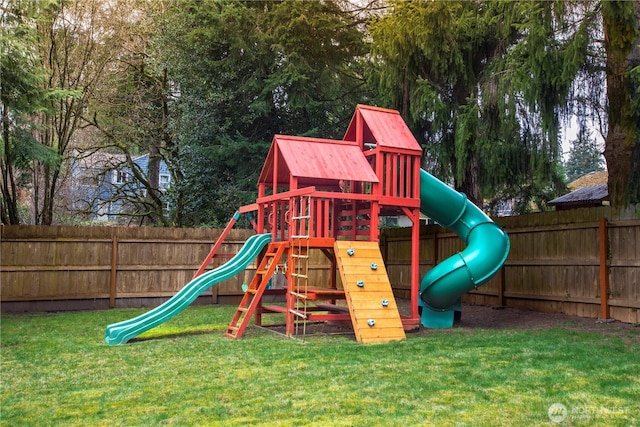 view of jungle gym featuring a fenced backyard and a lawn