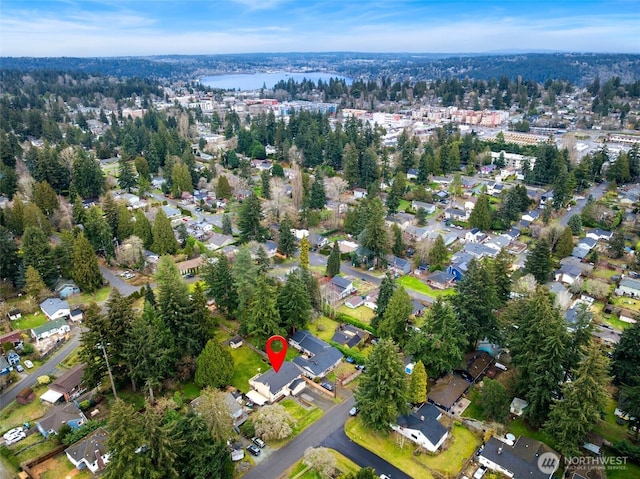 birds eye view of property with a water view