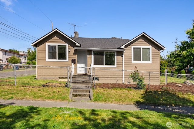 view of front facade featuring a front yard, fence, roof with shingles, and a chimney