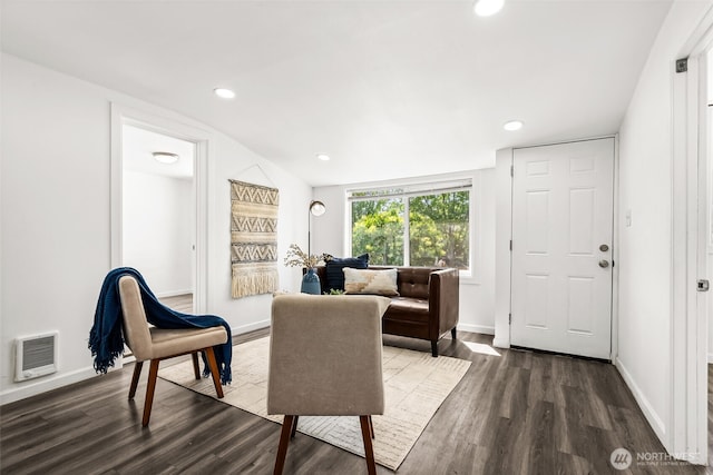 living area with recessed lighting, baseboards, and dark wood-style flooring