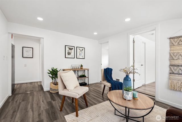 sitting room with recessed lighting, wood finished floors, and baseboards