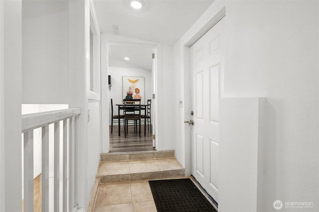 hall featuring tile patterned floors and recessed lighting