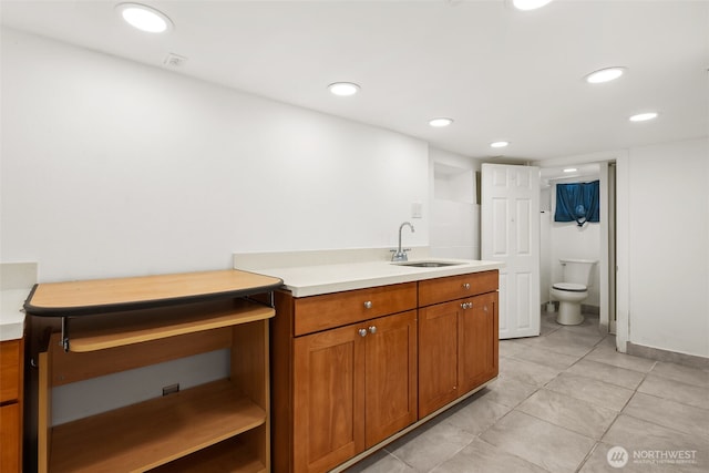 bathroom with recessed lighting, toilet, and vanity