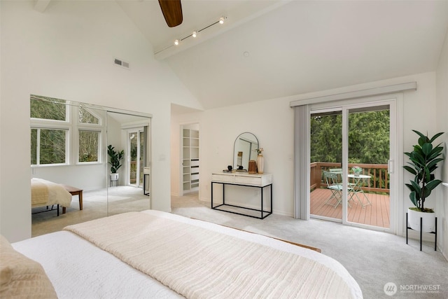 bedroom featuring a ceiling fan, visible vents, high vaulted ceiling, light carpet, and access to outside