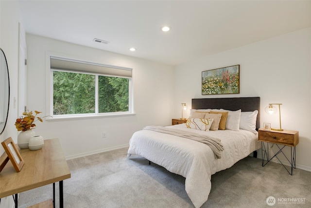 bedroom featuring recessed lighting, visible vents, light colored carpet, and baseboards