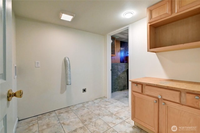 kitchen with light countertops and light brown cabinets