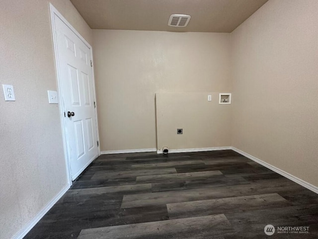 clothes washing area with hookup for a washing machine, wood finished floors, visible vents, baseboards, and laundry area