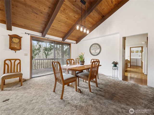 dining space featuring beamed ceiling, high vaulted ceiling, an inviting chandelier, wooden ceiling, and carpet flooring