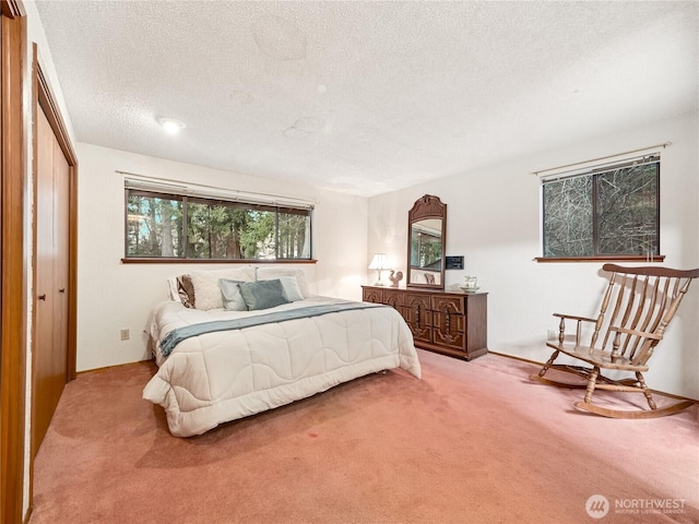 carpeted bedroom with a textured ceiling