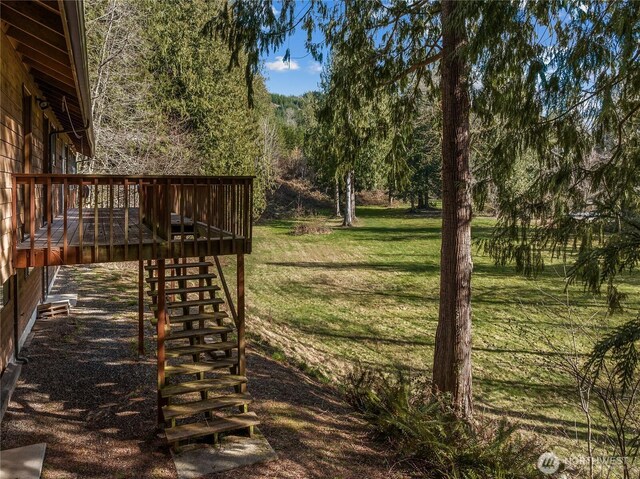 view of yard featuring a wooden deck