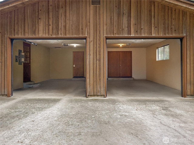 below grade area with visible vents and wood walls