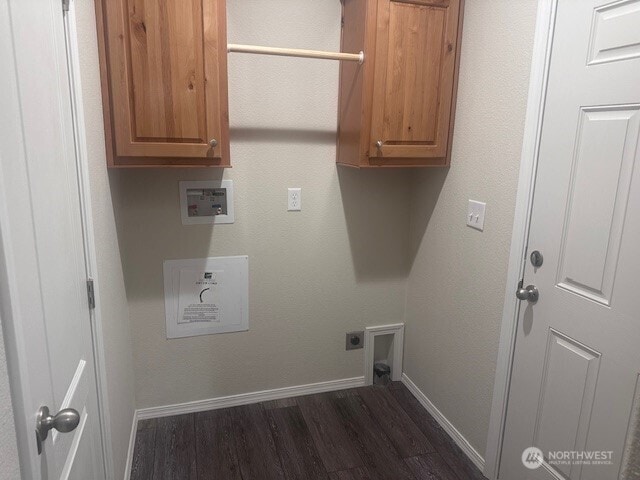 laundry area featuring dark wood-type flooring, baseboards, hookup for a washing machine, cabinet space, and hookup for an electric dryer