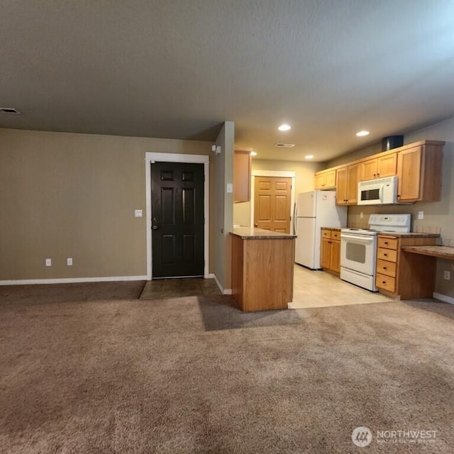 kitchen with baseboards, white appliances, light colored carpet, and open floor plan