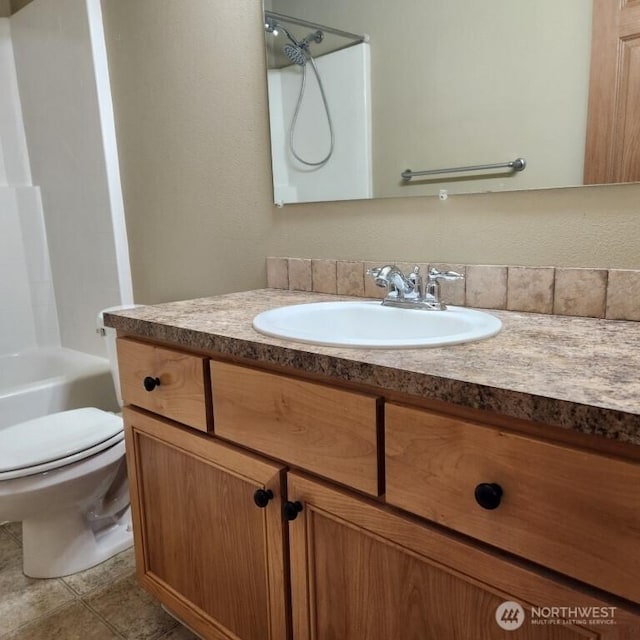 bathroom with shower / bath combination, toilet, vanity, and tile patterned flooring