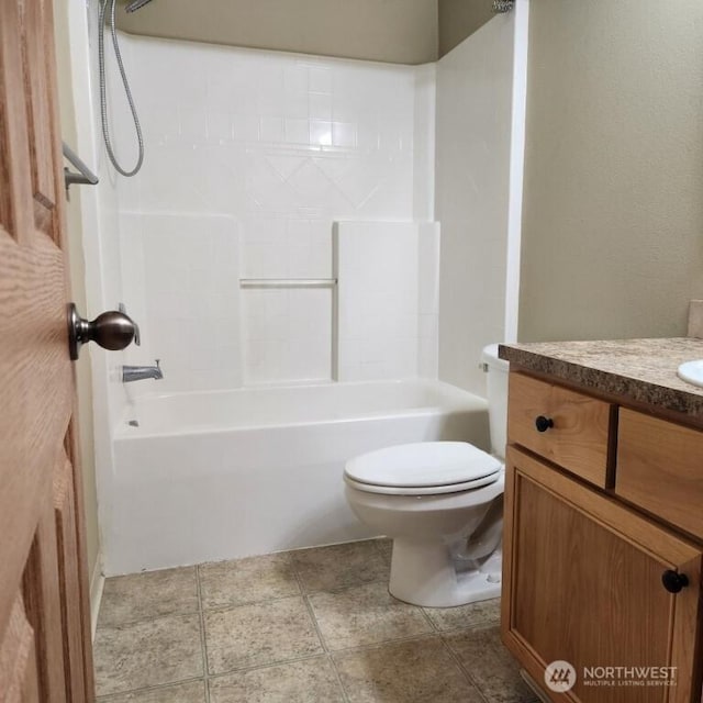 full bath featuring vanity, toilet, and washtub / shower combination