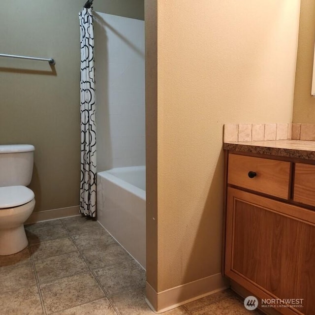 bathroom featuring tile patterned flooring, toilet, shower / tub combo with curtain, and baseboards