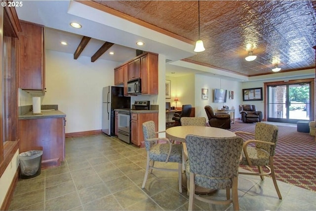 dining area with baseboards, a tray ceiling, ornamental molding, recessed lighting, and an ornate ceiling