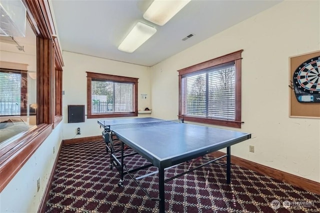 recreation room with visible vents and baseboards