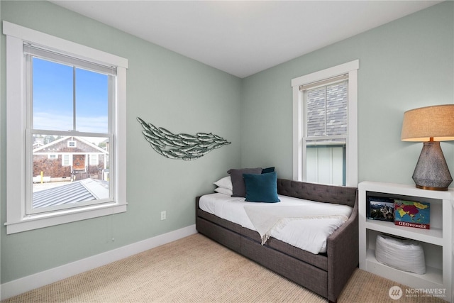 carpeted bedroom with baseboards