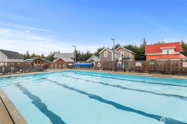 community pool featuring fence