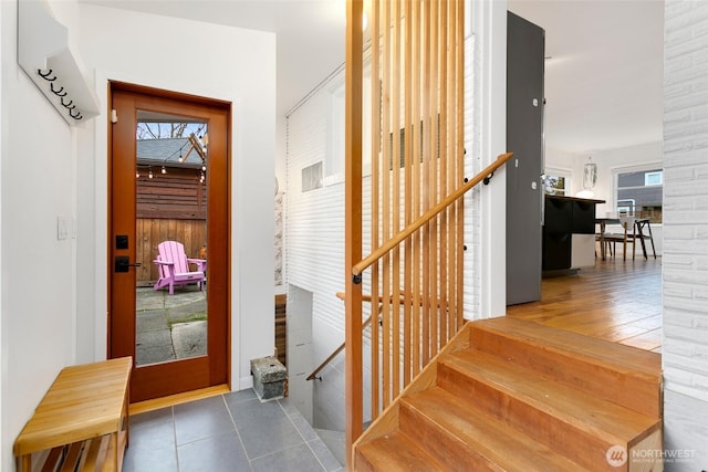 stairway featuring tile patterned floors