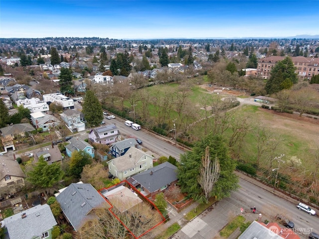 birds eye view of property with a residential view