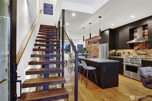 staircase featuring recessed lighting and hardwood / wood-style flooring