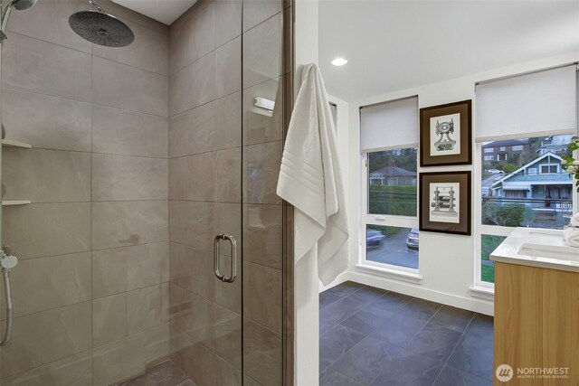 bathroom with vanity and a shower stall