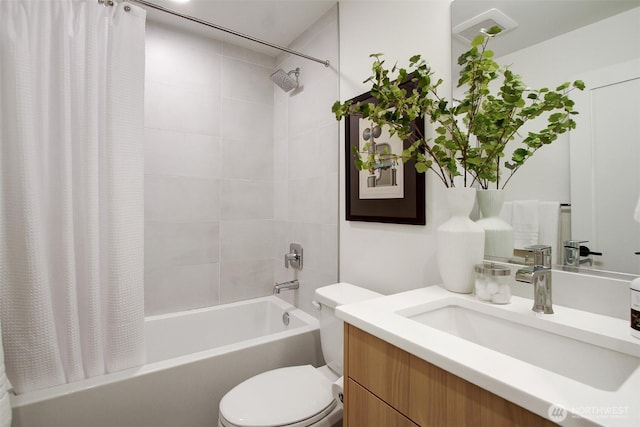 full bathroom featuring vanity, toilet, and shower / tub combo with curtain