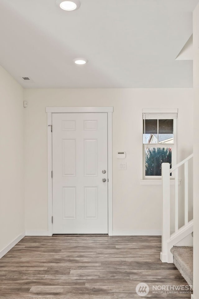 entryway featuring stairs, recessed lighting, wood finished floors, and baseboards