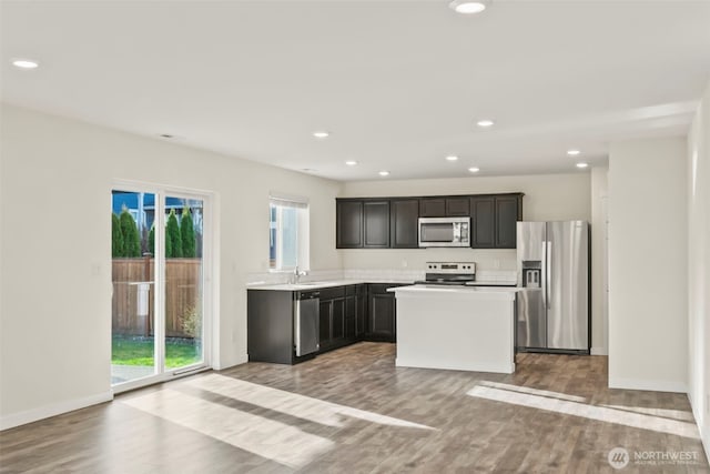 kitchen with plenty of natural light, recessed lighting, stainless steel appliances, and light wood-type flooring