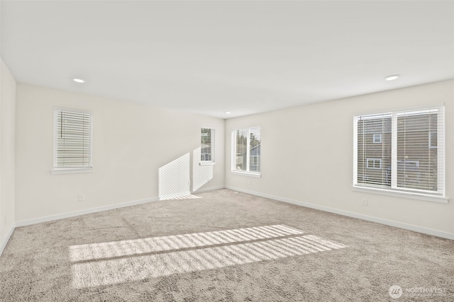 unfurnished room featuring recessed lighting, baseboards, and carpet floors