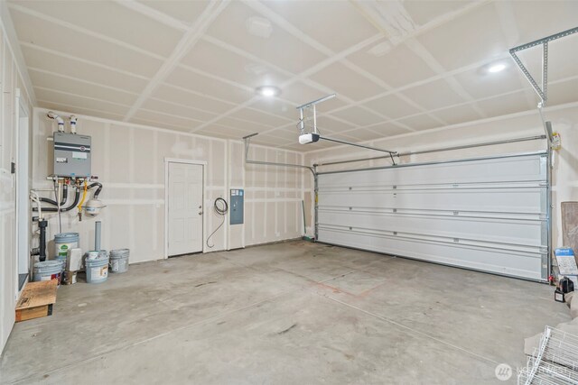 garage with electric panel and a garage door opener