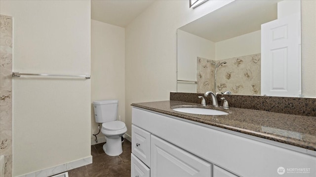 full bathroom with tile patterned floors, toilet, vanity, and baseboards